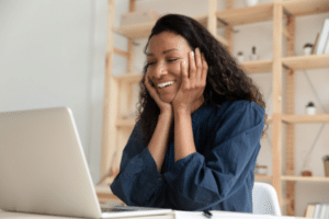 happy woman receives invite to select a holiday gift online